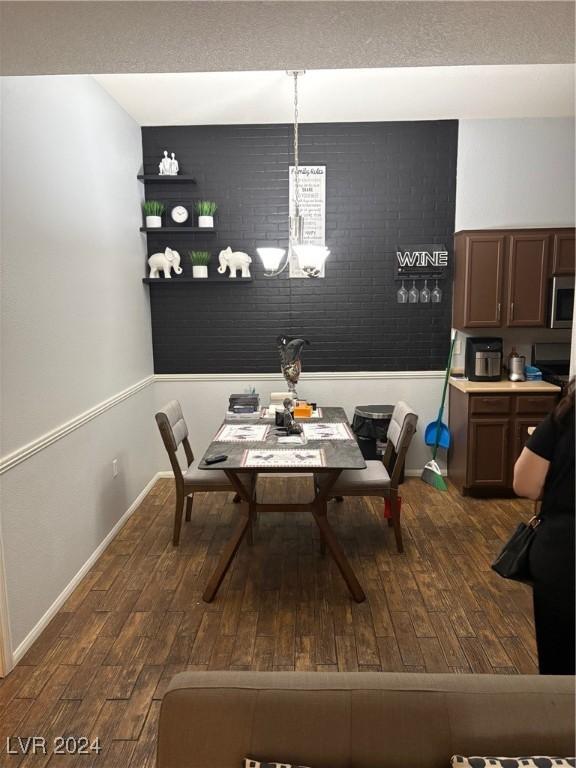 2305 W Horizon Ridge Parkway Unit 3512, Henderson, NV 89052 - dining room with dark wood-style flooring and baseboards