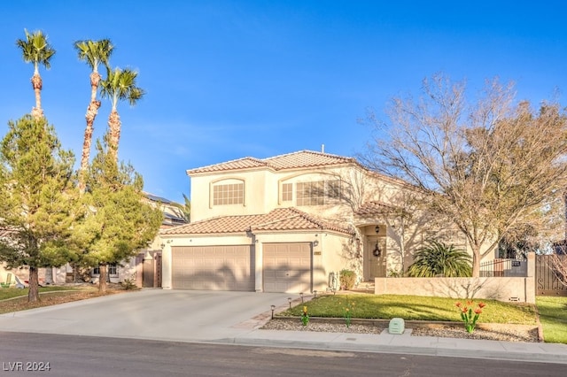 mediterranean / spanish-style house featuring a garage