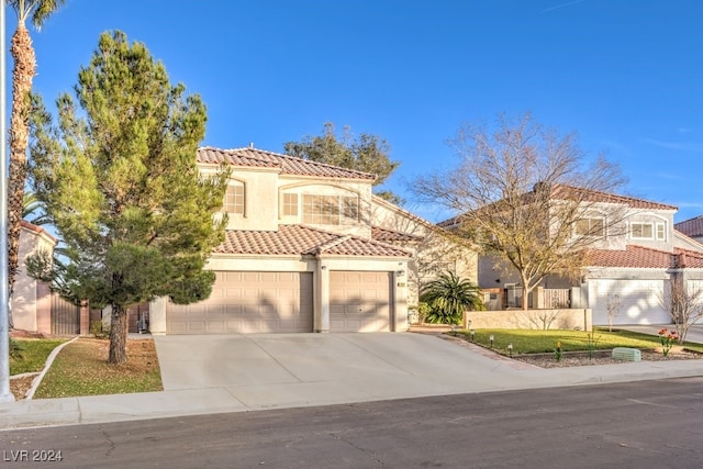 mediterranean / spanish-style house featuring a garage