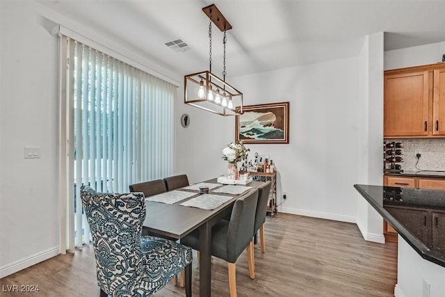 dining space featuring hardwood / wood-style floors