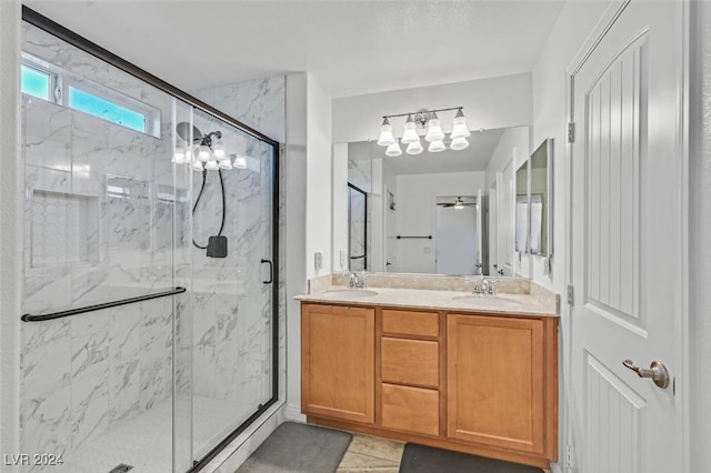 bathroom with vanity and a shower with door