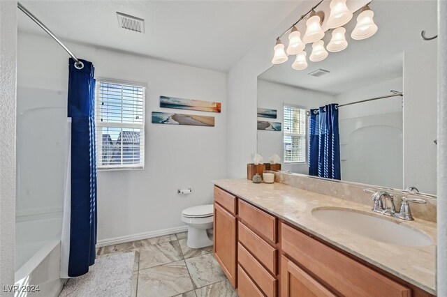 full bathroom featuring vanity, shower / bath combination with curtain, and toilet