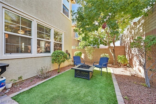 view of yard with an outdoor fire pit