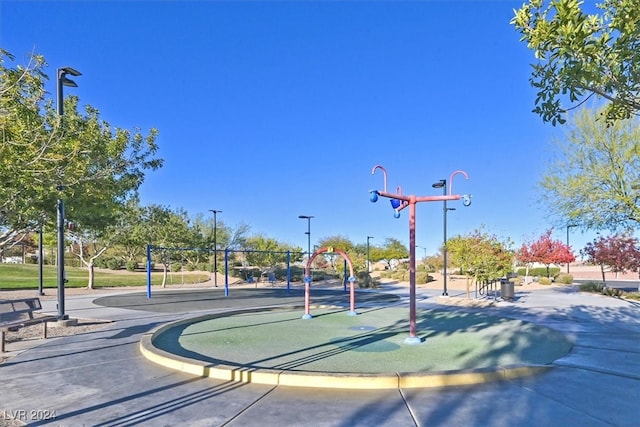 view of sport court with a playground