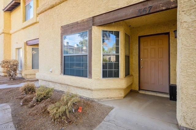 567 Kristin Ln, Henderson, NV 89011 - property entrance with stucco siding