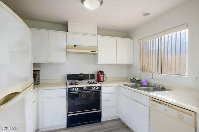 567 Kristin Ln, Henderson, NV 89011 - kitchen featuring white appliances, under cabinet range hood, a sink, white cabinets, and light countertops