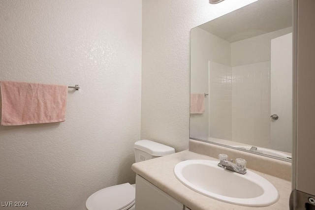 567 Kristin Ln, Henderson, NV 89011 - bathroom with a textured wall, vanity, and toilet