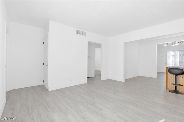 unfurnished room featuring light wood-type flooring