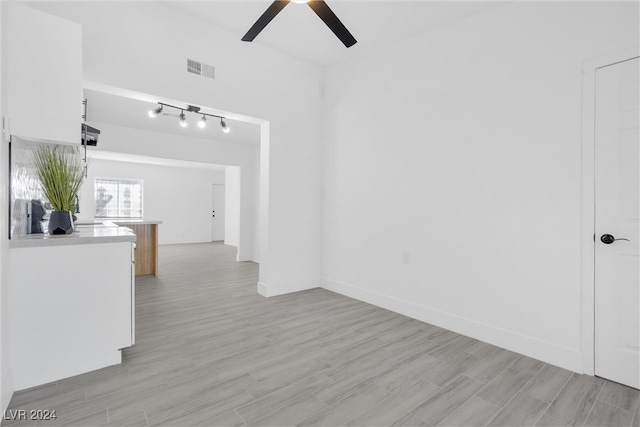 interior space featuring light wood-type flooring and ceiling fan