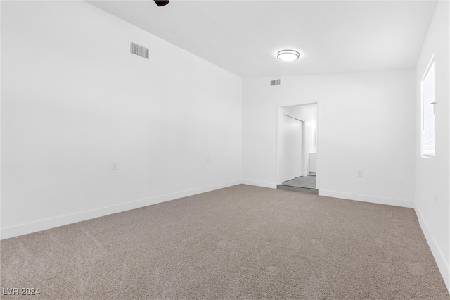 unfurnished room featuring carpet flooring