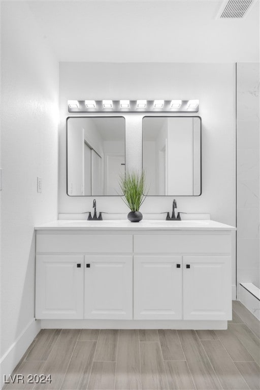 bathroom featuring vanity and hardwood / wood-style flooring