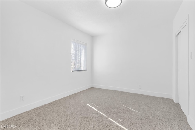 unfurnished room with carpet floors