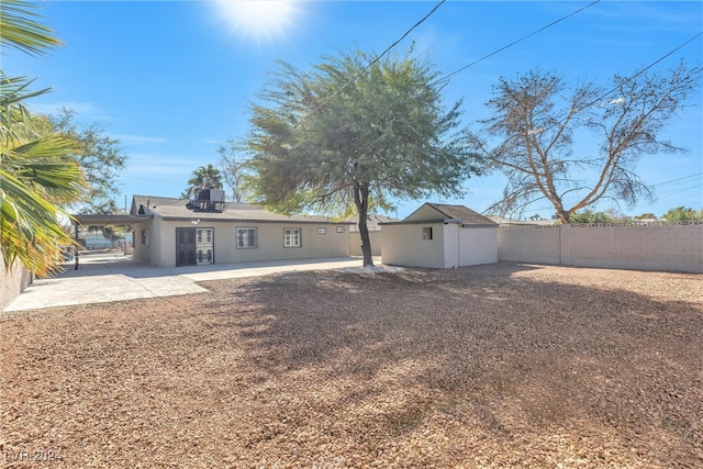 rear view of property featuring a patio area