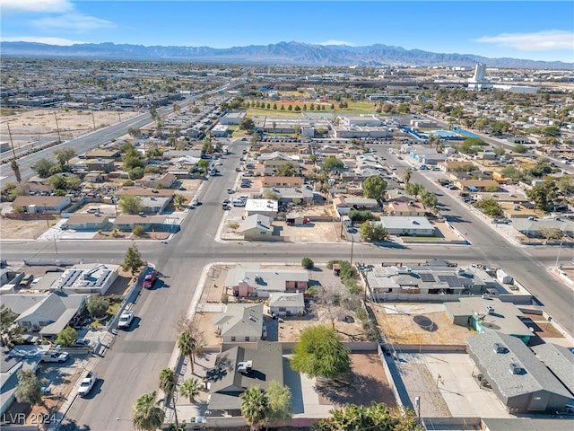 birds eye view of property featuring a mountain view