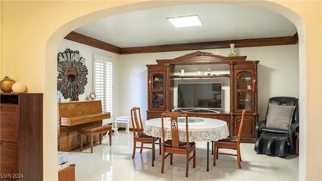 tiled dining space with crown molding