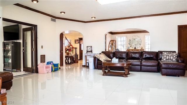 tiled living room with ornamental molding