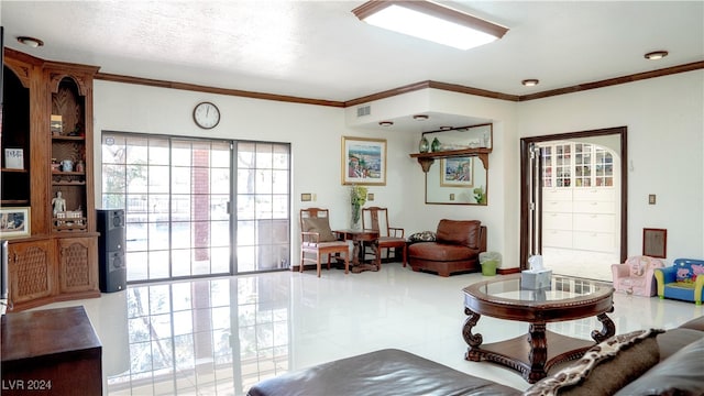 tiled living room with plenty of natural light, a textured ceiling, and crown molding