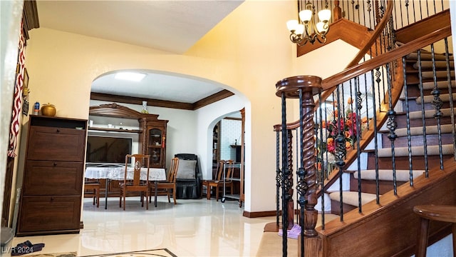 interior space featuring a chandelier and crown molding