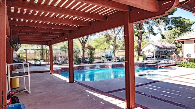 view of pool featuring a patio, a pergola, and an in ground hot tub