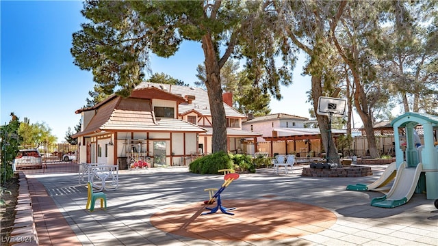 exterior space with a fire pit and a patio area