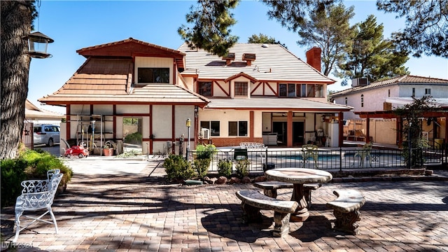 rear view of house featuring a patio