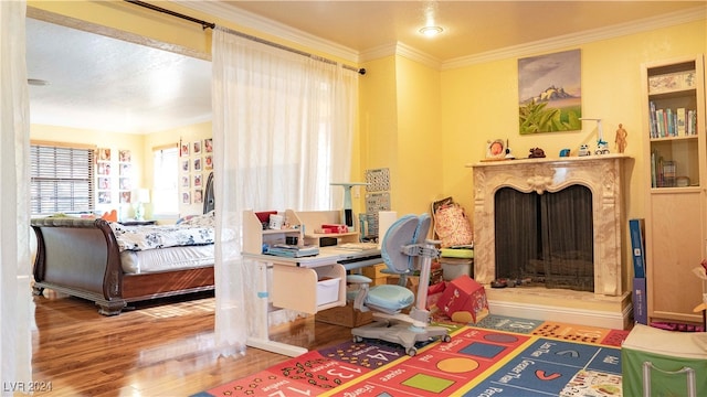 bedroom featuring hardwood / wood-style floors and crown molding