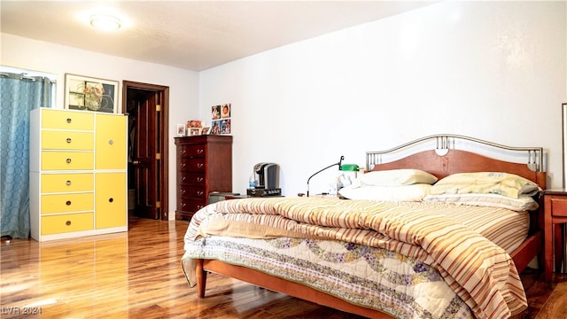 bedroom featuring hardwood / wood-style floors