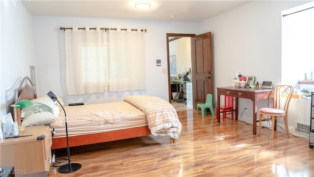 bedroom featuring hardwood / wood-style flooring