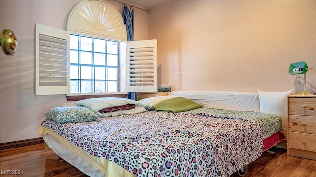 bedroom with wood-type flooring