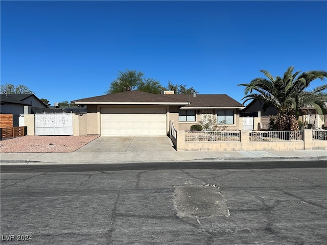 single story home featuring a garage