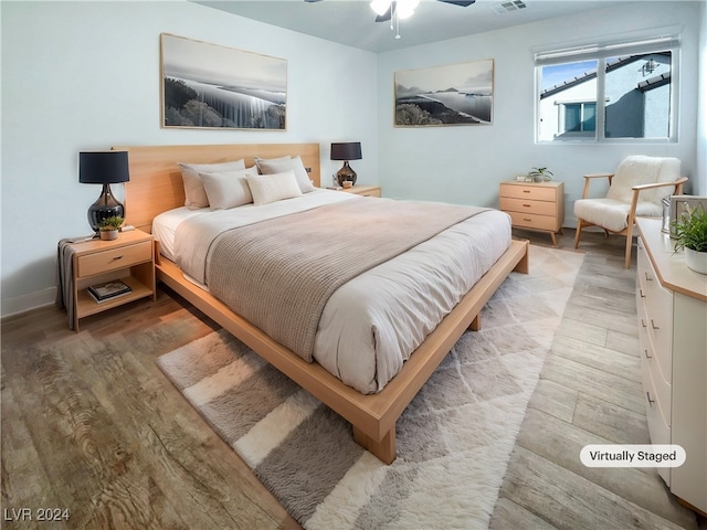 bedroom featuring light wood-type flooring and ceiling fan