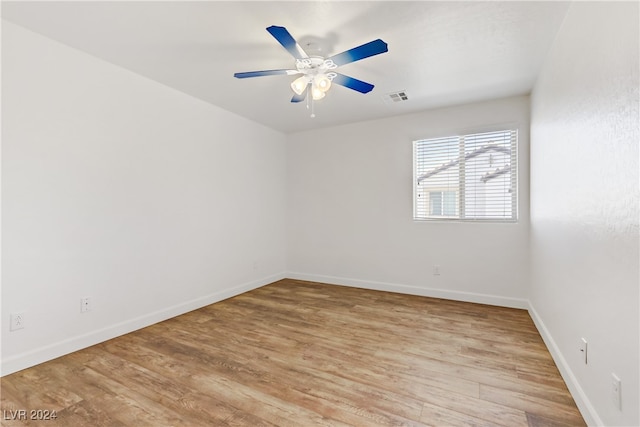 empty room featuring ceiling fan and light hardwood / wood-style floors