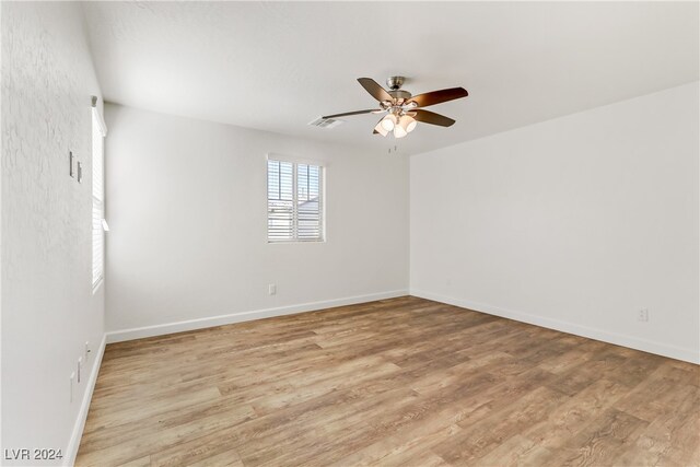 unfurnished room with light hardwood / wood-style floors and ceiling fan