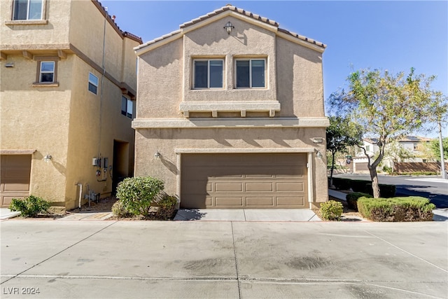 view of front of property featuring a garage