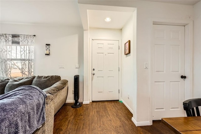 interior space with dark wood finished floors and baseboards