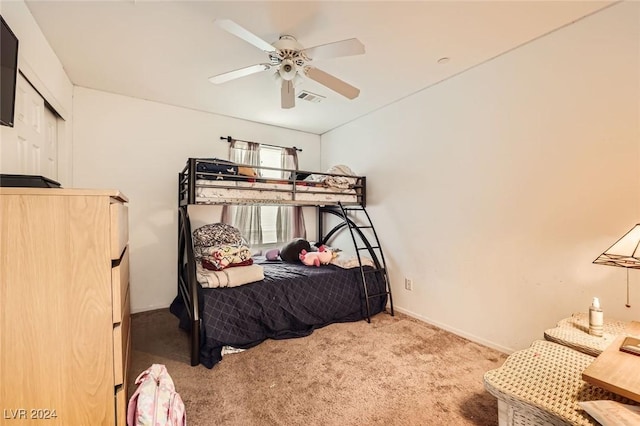 bedroom featuring visible vents, carpet floors, baseboards, and a ceiling fan