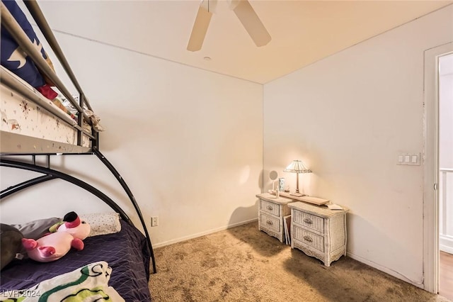 unfurnished bedroom with baseboards, a ceiling fan, and carpet