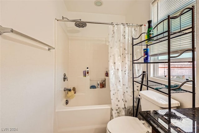 bathroom featuring toilet and shower / tub combo