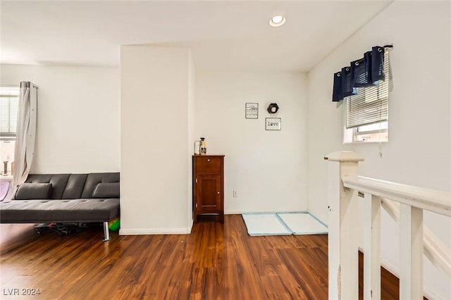 interior space with recessed lighting, baseboards, plenty of natural light, and wood finished floors