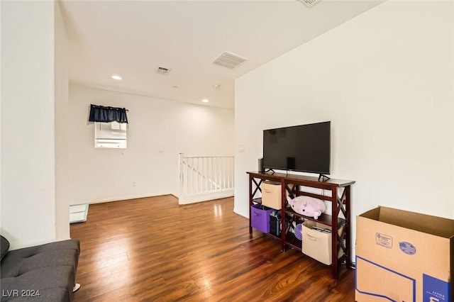 playroom with visible vents, recessed lighting, a baseboard heating unit, and wood finished floors