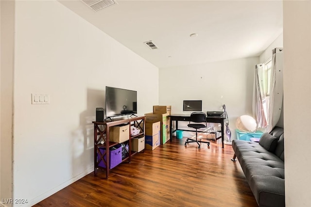 office with wood finished floors, visible vents, and baseboards