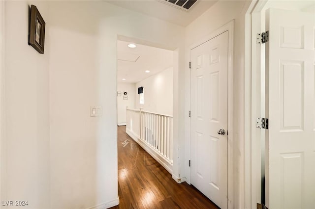 corridor with recessed lighting, visible vents, and dark wood finished floors