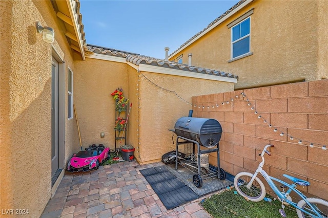 view of patio with fence and grilling area