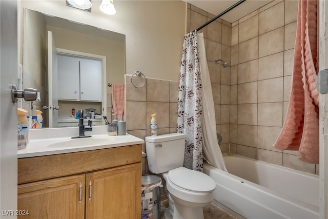 full bathroom with vanity, toilet, and shower / tub combo with curtain