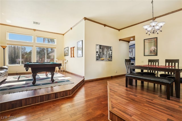 interior space featuring pool table, a chandelier, hardwood / wood-style flooring, and ornamental molding