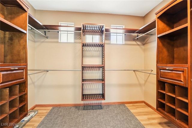 walk in closet featuring light hardwood / wood-style floors