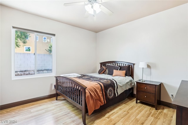 bedroom featuring light wood-type flooring and ceiling fan