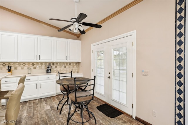 interior space with white cabinetry, french doors, lofted ceiling, and dark hardwood / wood-style floors