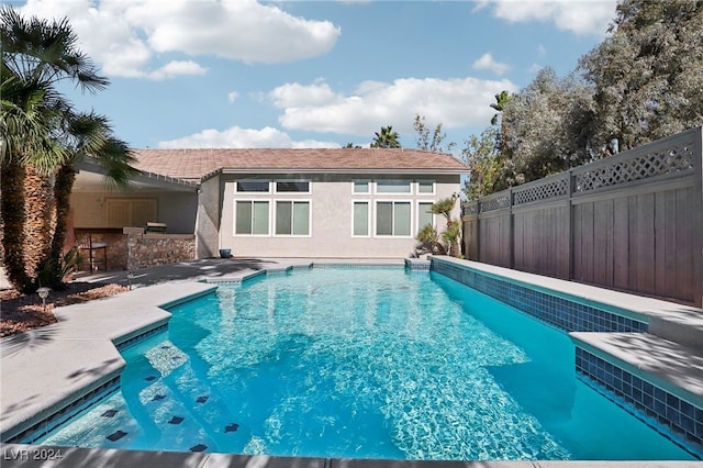 view of swimming pool featuring a patio