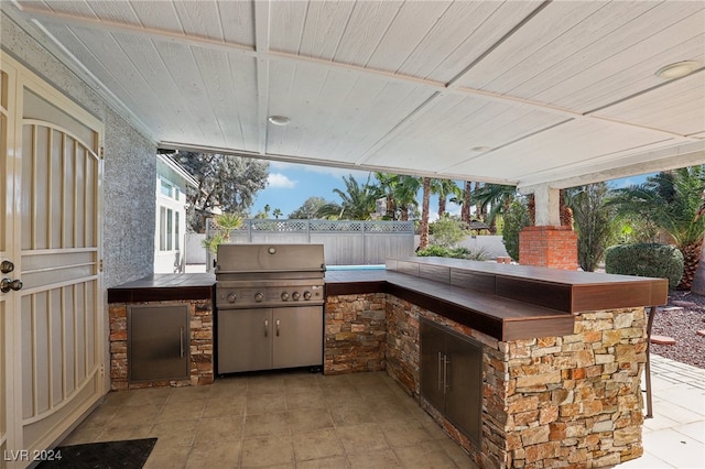 view of patio / terrace featuring area for grilling and exterior kitchen